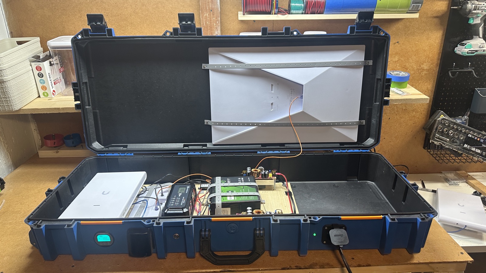 SatPack Pro internals showing custom electronics, networking, and battery system